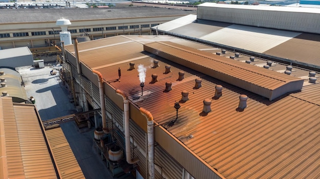 aerial-view-old-dirty-factory-ventilate-pollution-smoke-gas-air-roof-factory-around-with-red-rust-cause-from-pollution-gas_33850-417
