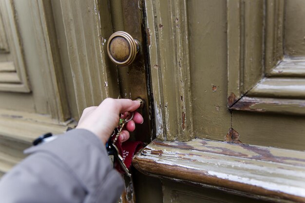 cropped-hand-opening-door_1048944-16456953
