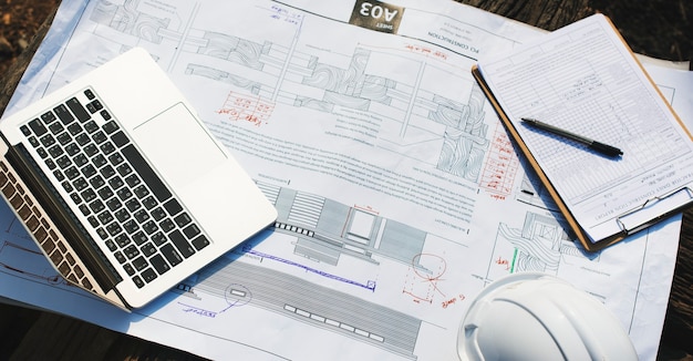 engineering-workspace-with-laptop_53876-147494