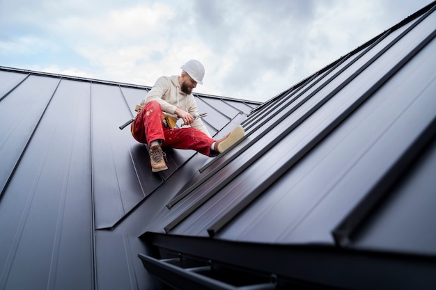 full-shot-man-working-roof_23-2149343660