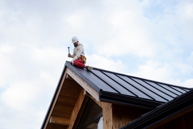 full-shot-man-working-roof_23-2149343677
