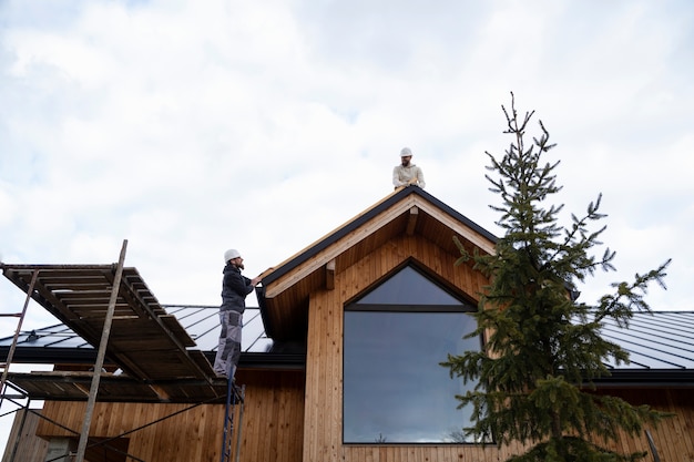 long-shot-men-working-together-roof_23-2149343674