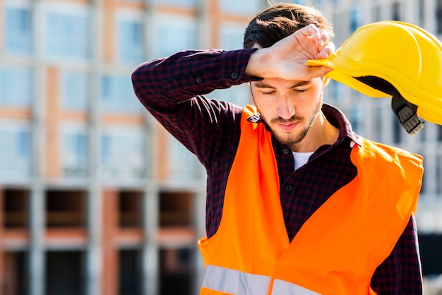 medium-shot-portrait-tired-construction-worker_23-2148233717